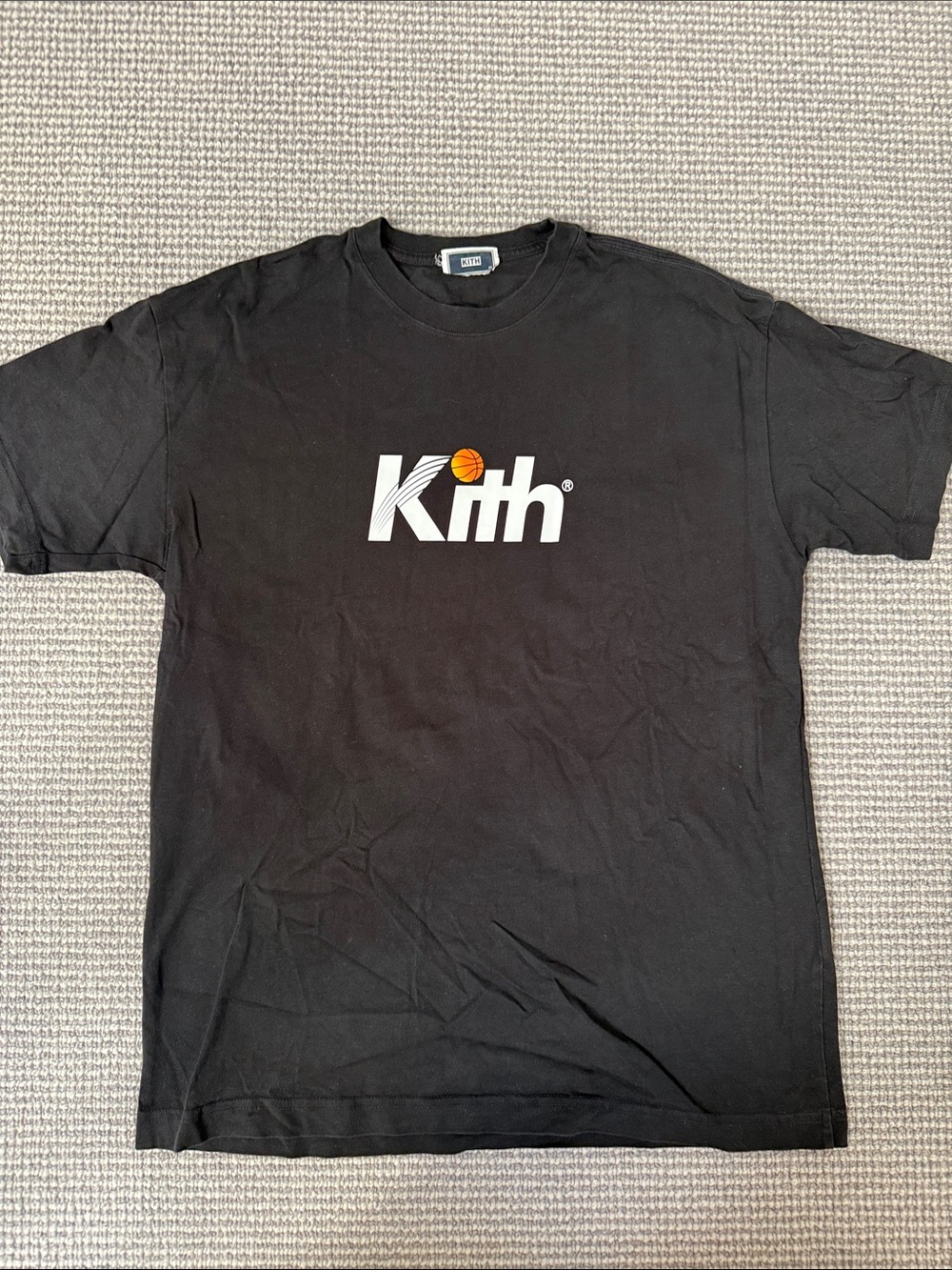 Kith Black Tee with White Logo and Orange Basketball Accent